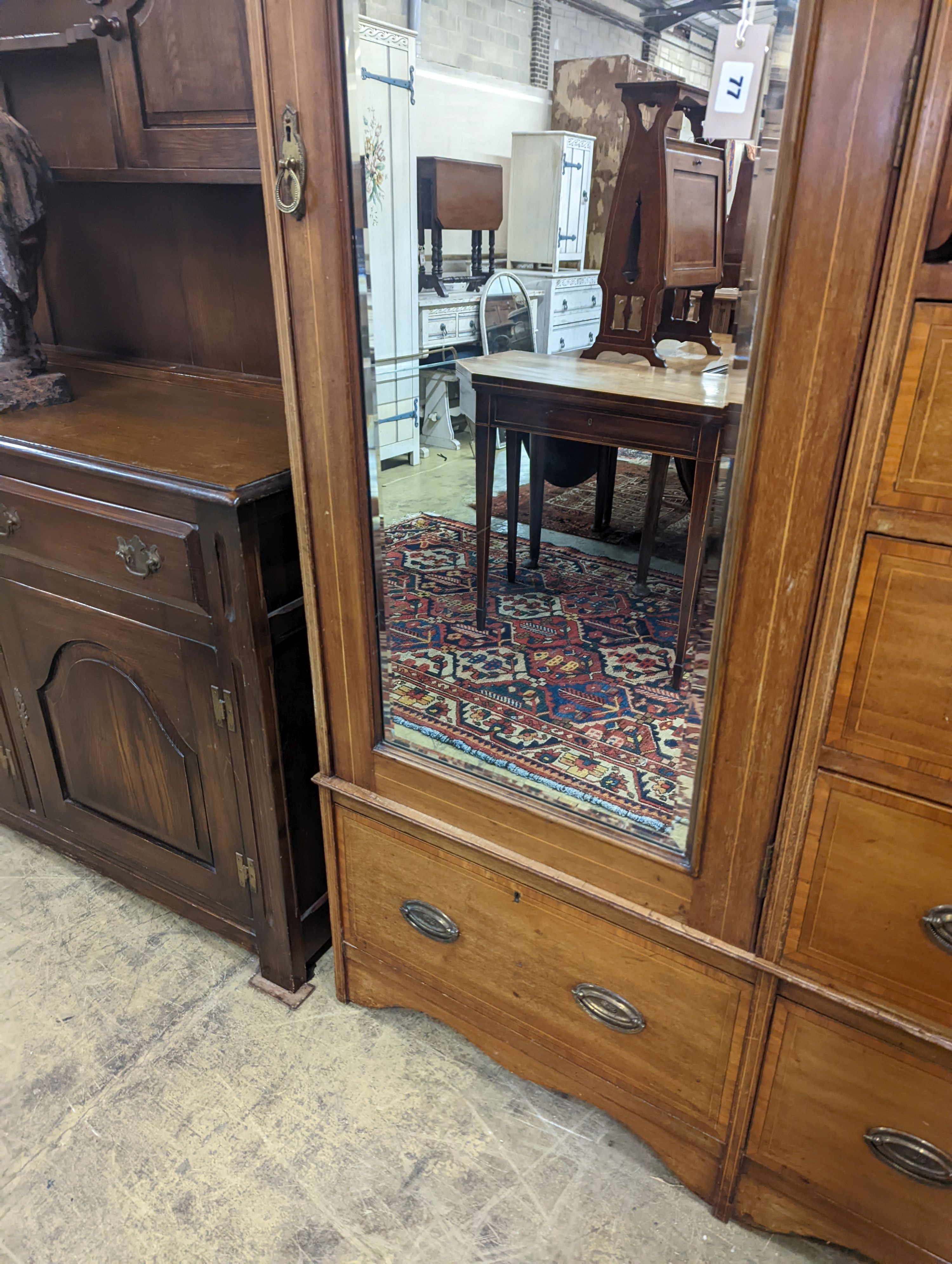 An Edwardian satinwood banded mahogany compactum wardrobe, length 136cm, depth 56cm, height 210cm